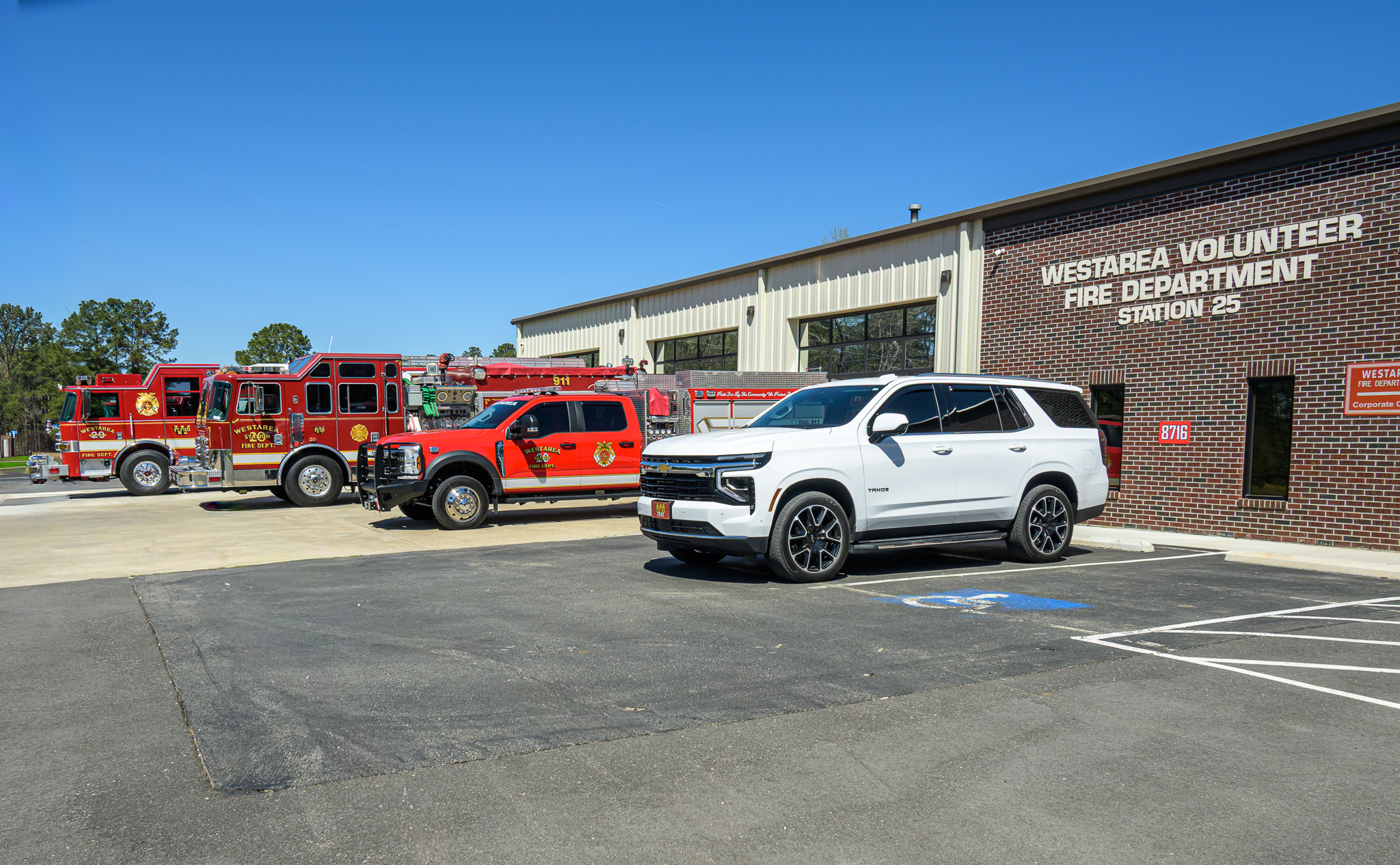 Station fleet lineup with trucks and SUV